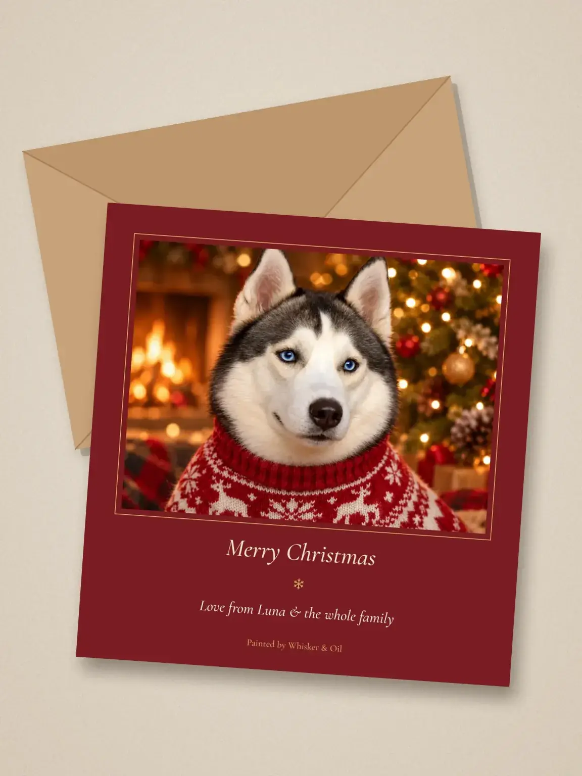 A Merry Christmas card with a husky pet portrait in a red knit sweater, lying on a kraft envelope